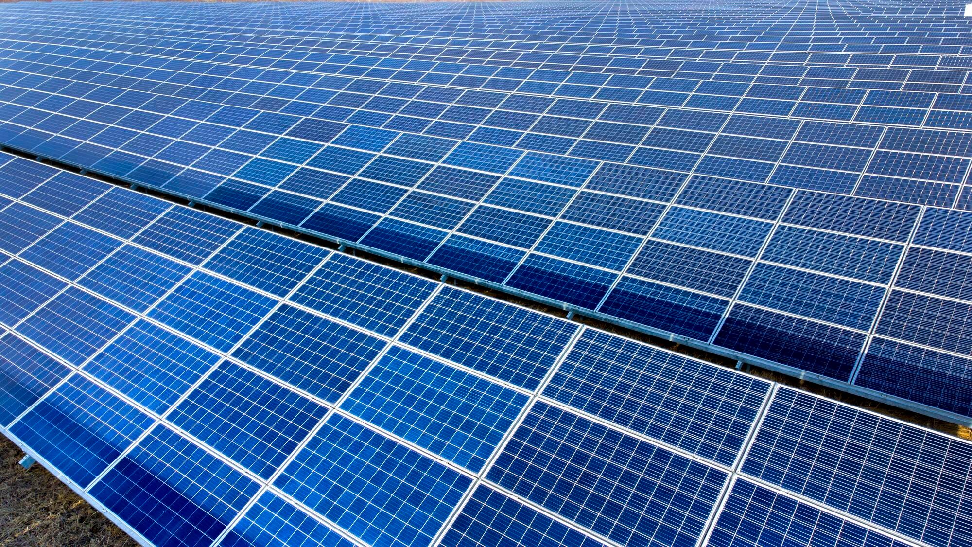 Team of solar installers working on a roof